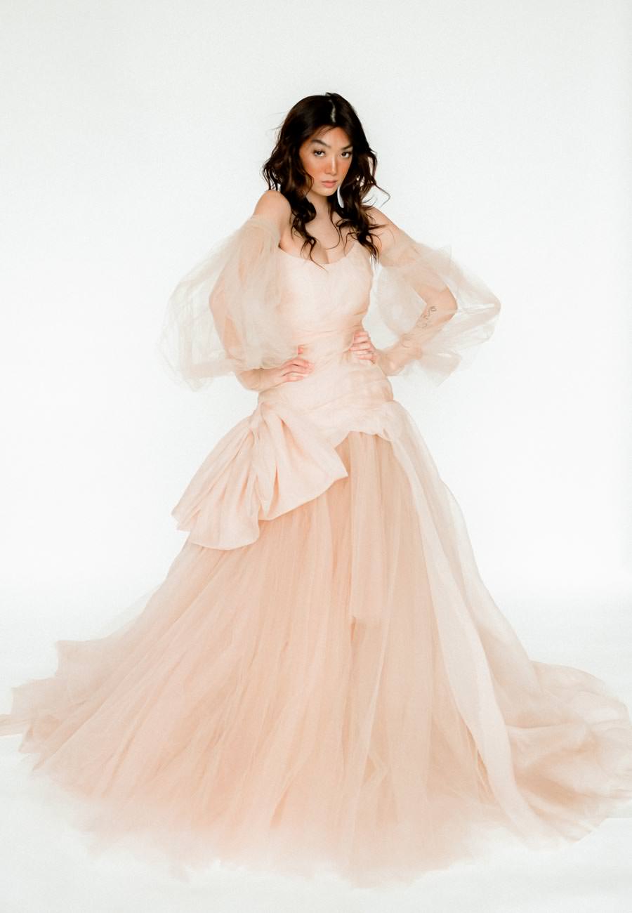 Rented Dress the bridal and maternity dress rental company by Claire La Faye for styled wedding shoots, workshops, and publications. model wearing nude tulle and silk ball gown Dune.