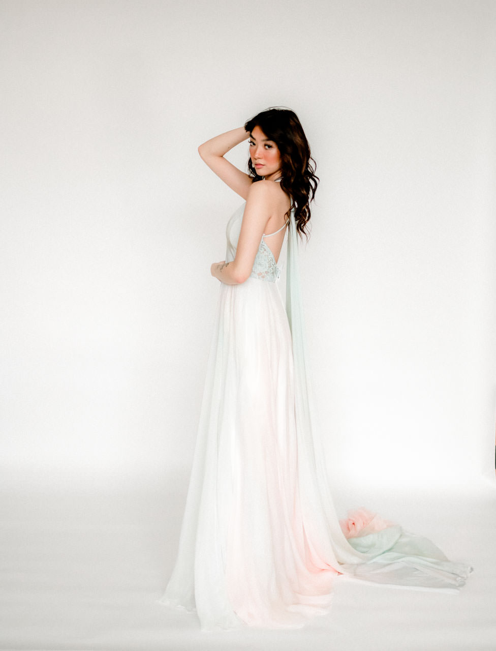 Vida Watercolor designer wedding gown with cape for rent to photographers, stylists, videographers, and other creatives to use in styled shoots and other editorial publications.